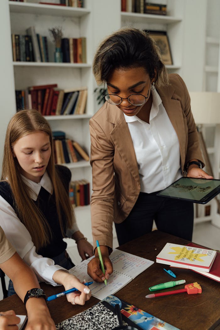 About A teacher and students engaged in a collaborative learning activity in a classroom.